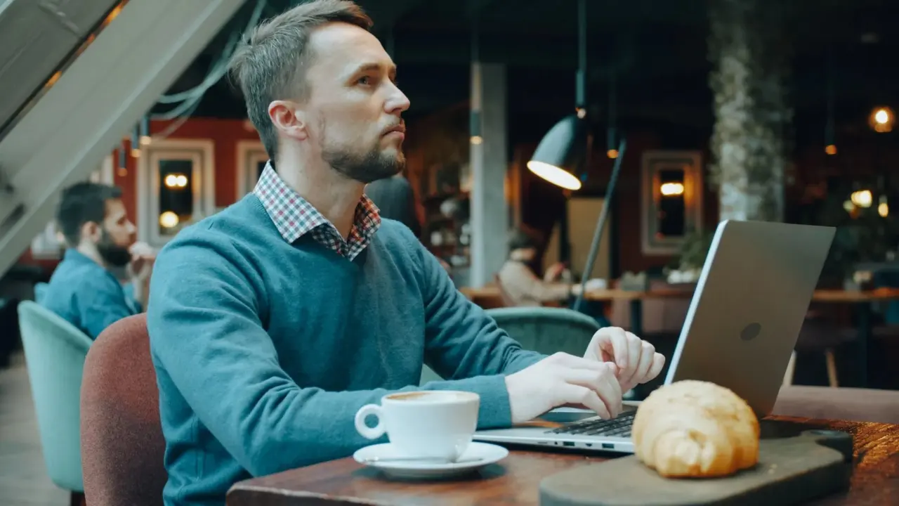 Reader browsing technology articles on a laptop