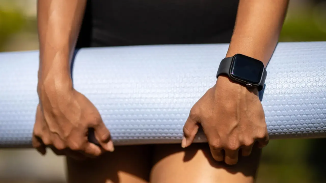 Smartwatch on a wrist showing fitness data